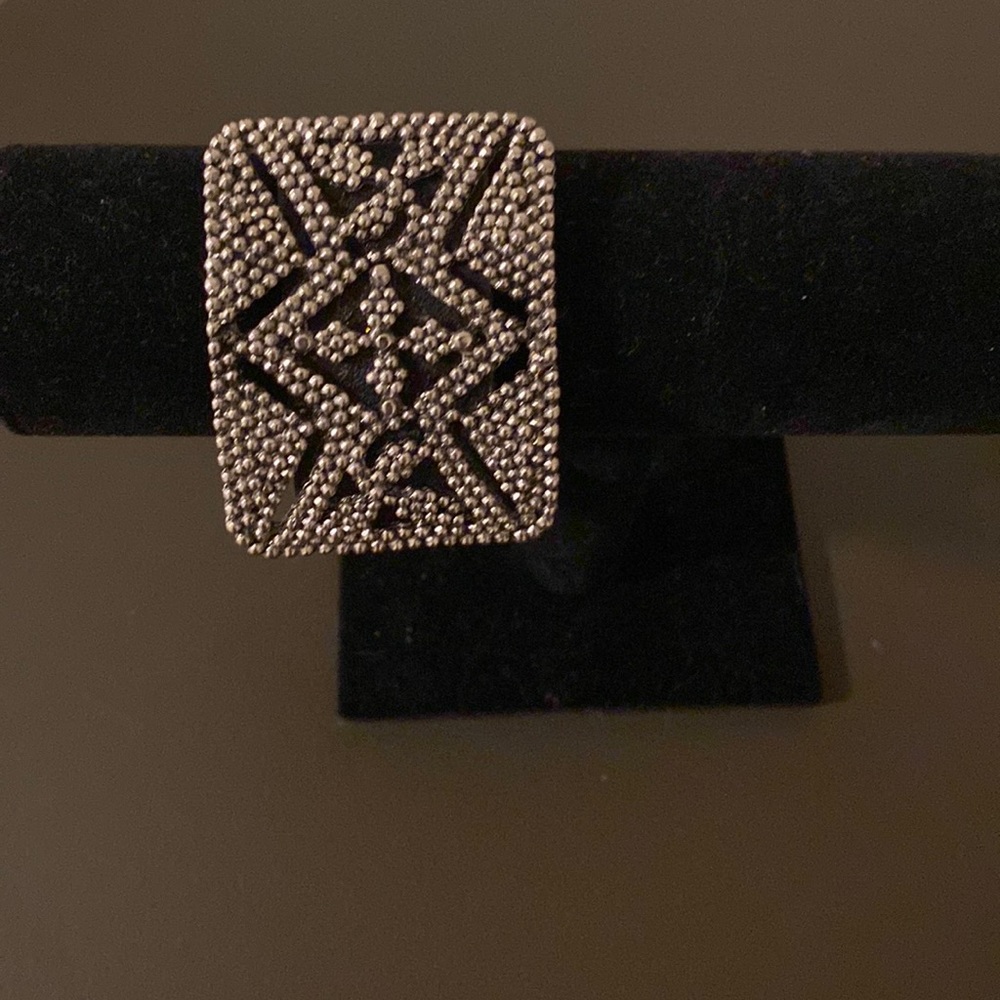 Black leather and silver cuff bracelet.